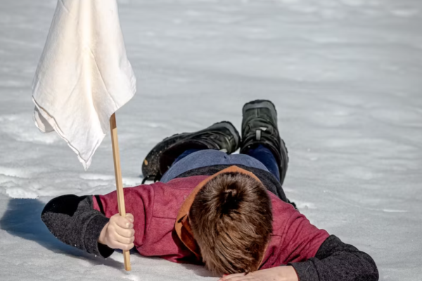 Man face down with white flag